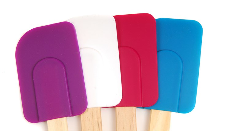 네 rubber and silicone spatulas in different colors