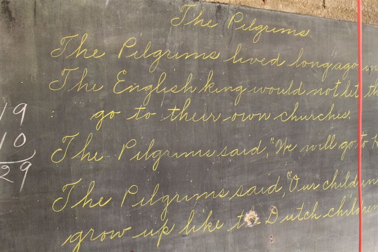 Satu chalkboard featured a teacher's beautiful cursive writing.