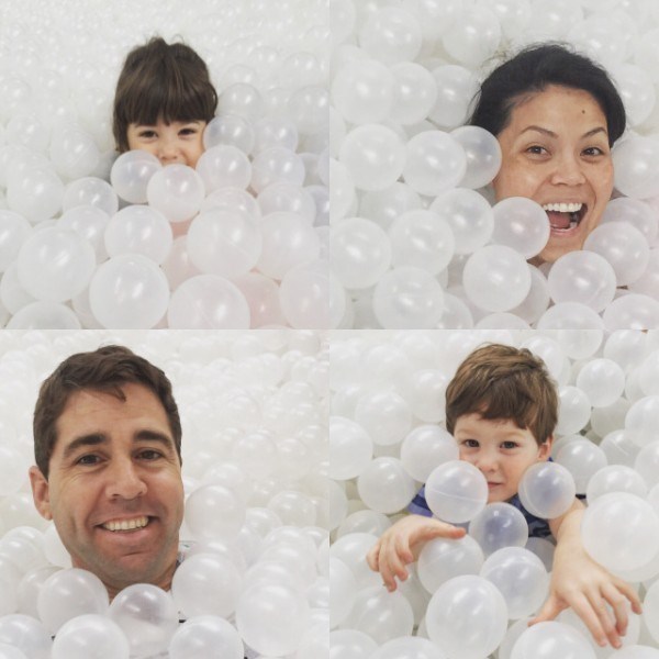 Famiglia plays in a ball pit