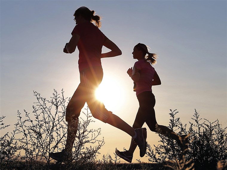 Runners take advantage of lower temperatures at sunrise
