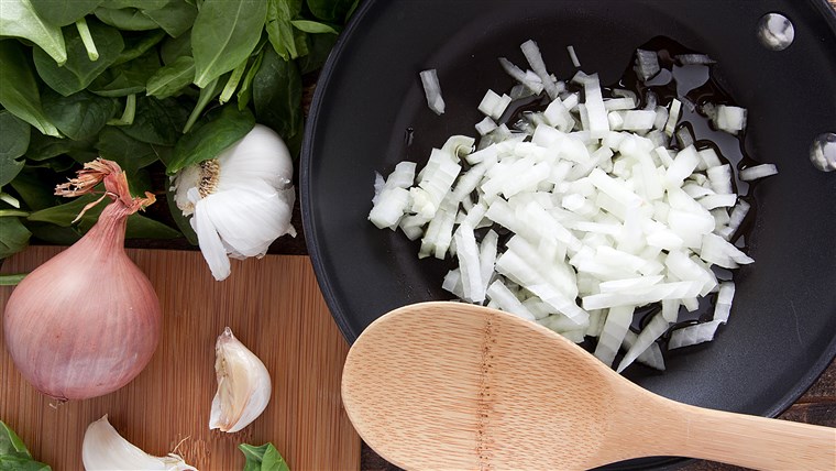 Dicincang onion in a nonstick frying pan before frying