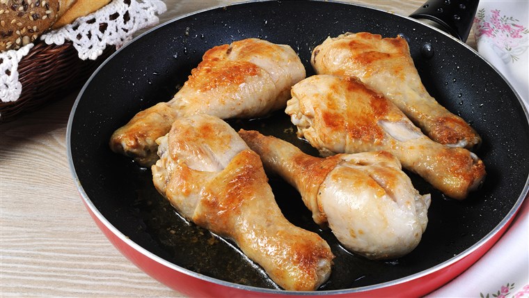 Ayam drumsticks in a nonstick pan