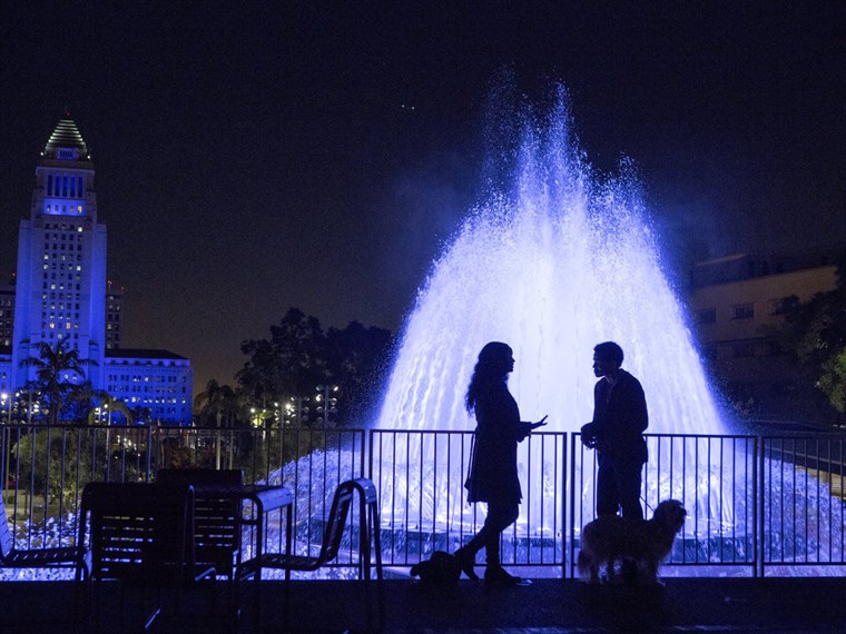Danny (Michael Ealy) and Debbie (Joy Bryant) walk their dog Pacino together on a romantic night in Los Angeles in 