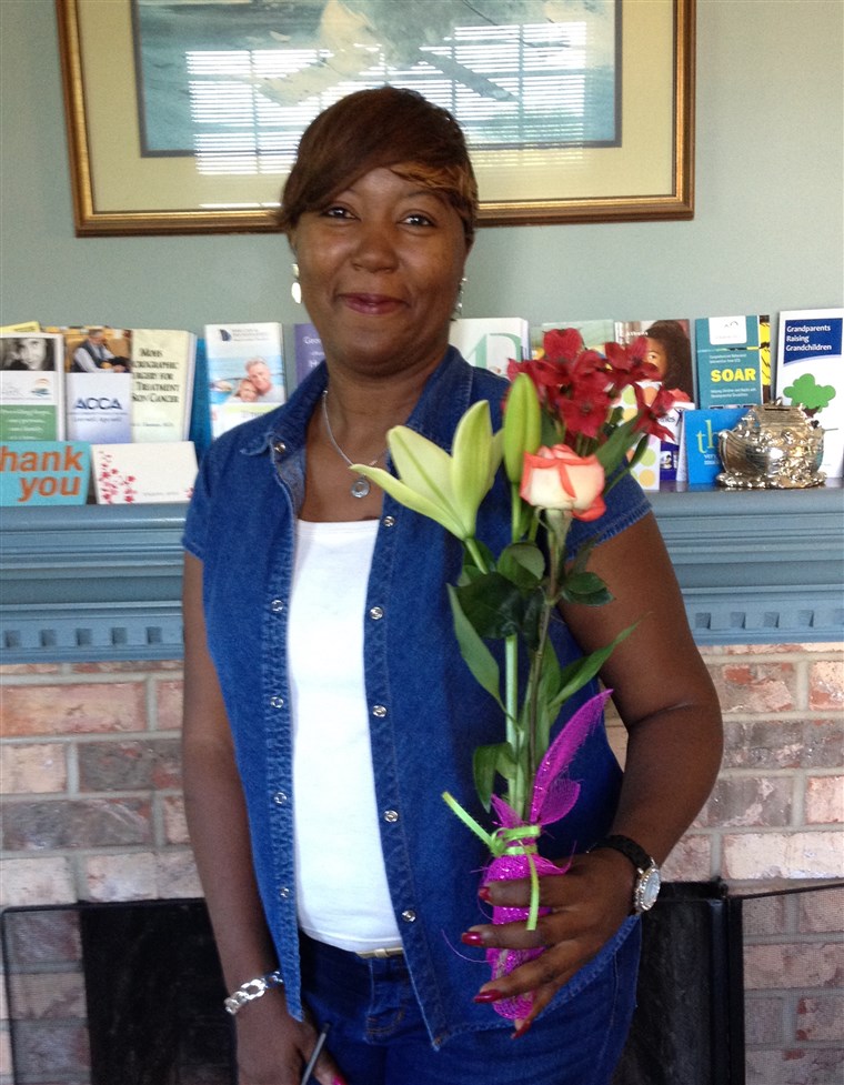 Juana Hulin with the Mother's Day bouquet from her Adopt-a-Mom sponsor.