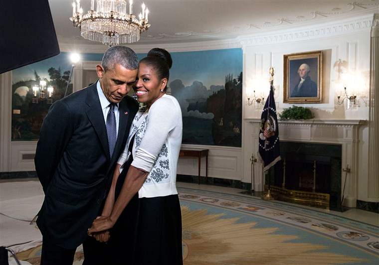 Primo Lady Michelle Obama snuggles against President Barack Obama before a videotaping for the 2015 World Expo, in the Diplomatic Reception Room of the White House, March 27, 2015.