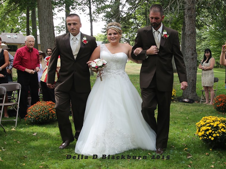 お父さん and stepfather shared duties walking Brittany Peck down the aisle at her wedding