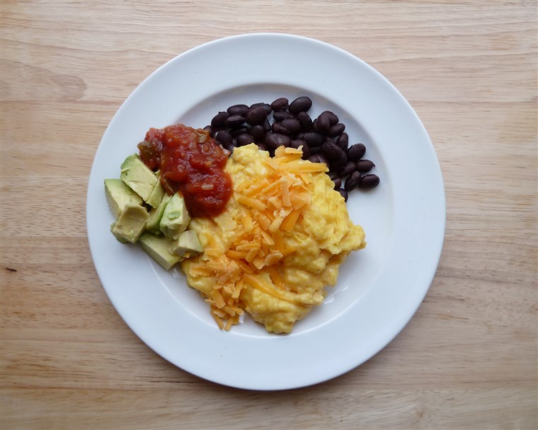 Strapazzate eggs with black beans, cheese, salsa and avocado