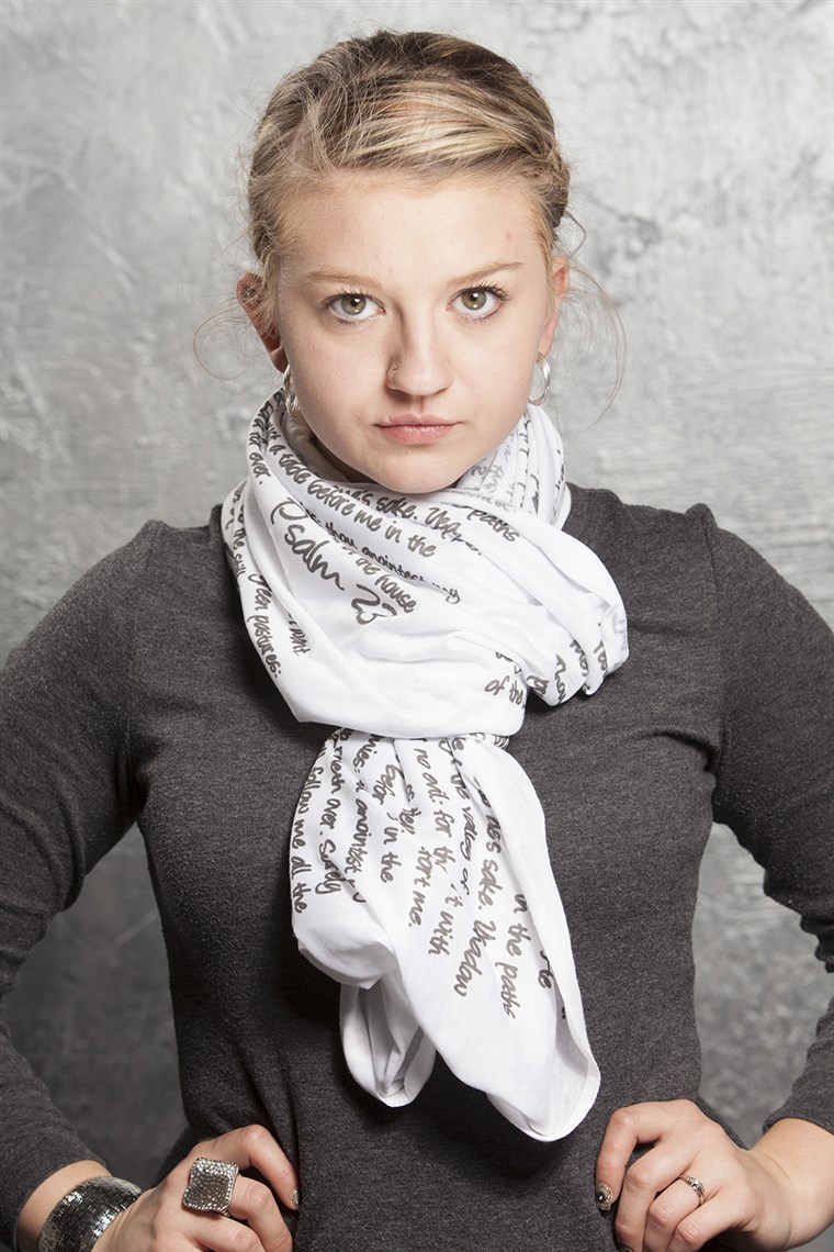 에이 model wears a scarf from the God Inspired Fashion collection.