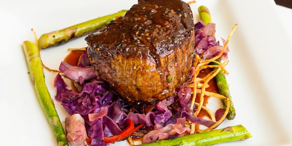 Tim Love's Easy Grilled Steak Stuffed with Roasted Garlic