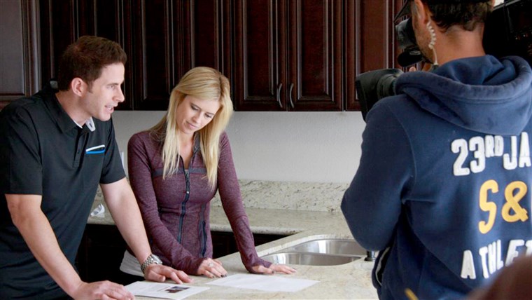 Marito and wife team, Tarek and Christina El Moussa, discuss renovation plans on the set of HGTV's Flip or Flop.