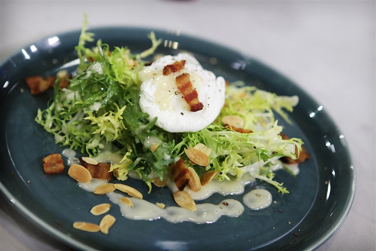in camicia eggs, frisee salad with bacon lardon, toasted almonds and Dijon vinaigrette