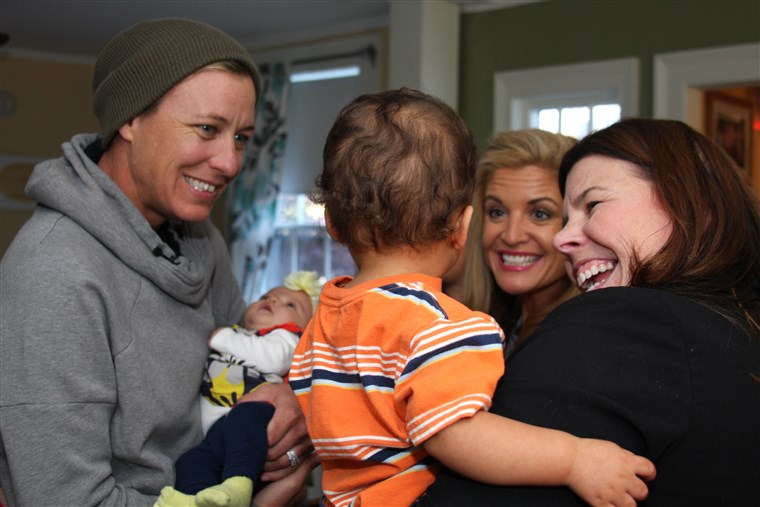 Doyle and wife, Abby Wambach, visit with residents of Hope on Haven Hill.