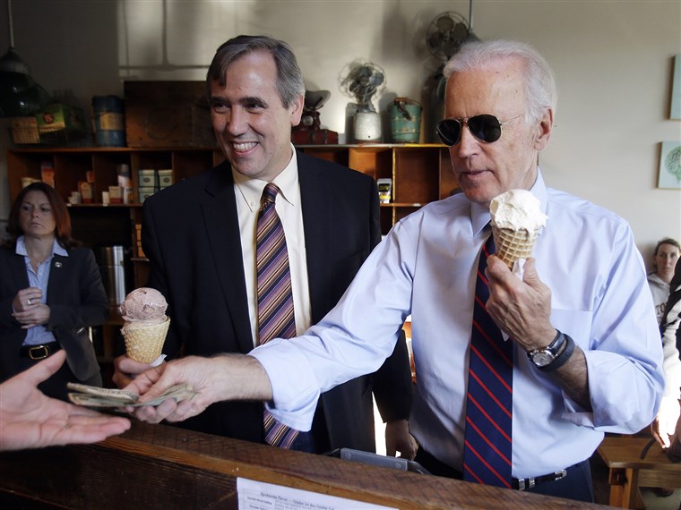 Wakil President Joe Biden, right, pays for ice cream cones for himself and U.S. Sen. Jeff Merkley after a campaign rally in Portland, Ore., Wednesday, ...