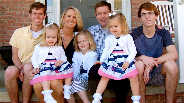Carolyn and Sean Savage with their five children... soon to be six. After years of struggling with infertlity -- and giving birth to another couple's child after an IVF clinic mistake -- this is one (happy) surprise she never expected.