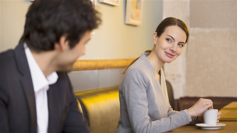 Imut Woman flirting with a man In Bar, restaurant; Shutterstock ID 180326066; PO: today.com