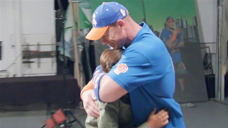 John Cena reacts to being surprised by young fan Tyler Schweer.