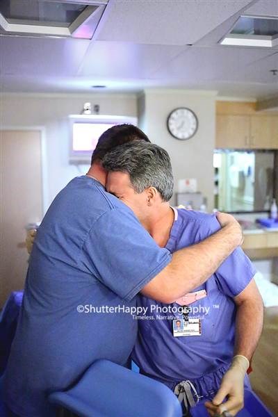 Andrea Hanson, left, hugs Dr. Bryan Hodges after he delivered his son Karson at St. Luke's Hospital in Boise, Idaho. Hanson's first baby died soon after birth less than a year earlier.
