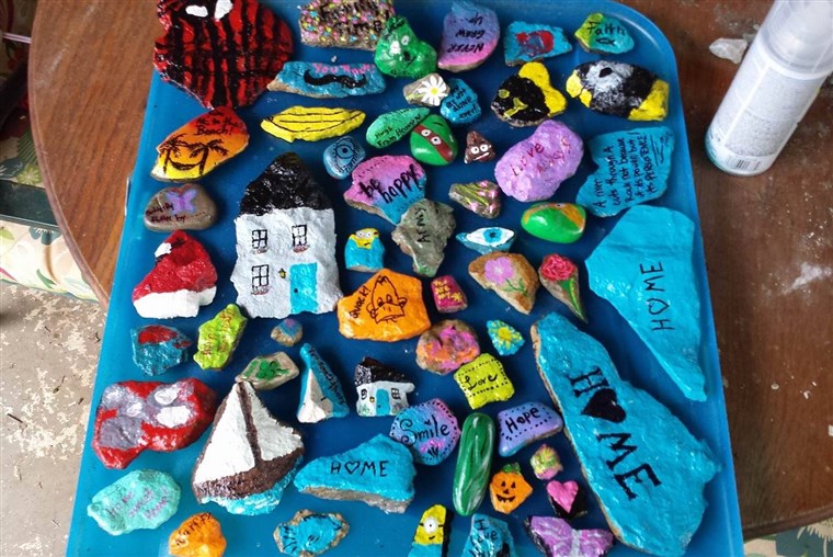Sarah Nalley serves as a moderator for the Nelson County, Kentucky rock group and says she and her two children love painting rocks together.