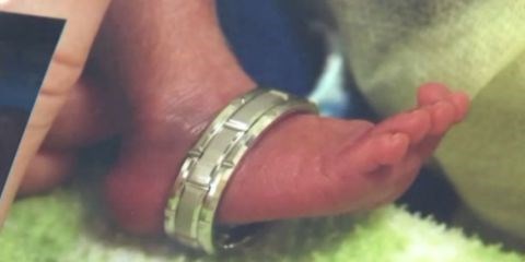 トレバー's foot was so tiny that his dad Bo Frolek was able to slip his wedding ring over it.