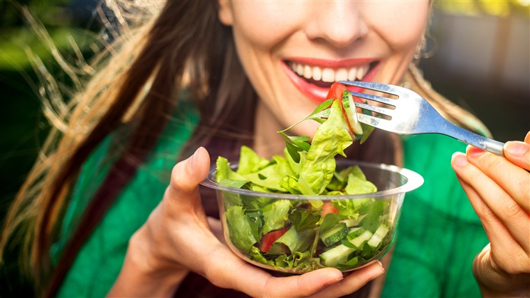 UN woman eats a salad