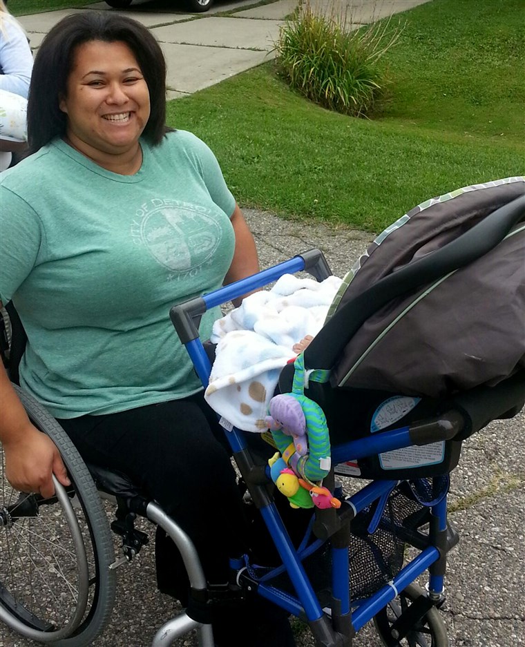 Jones on a walk with son, Grover, using the wheelchair stroller attachment designed by Alden Kane.