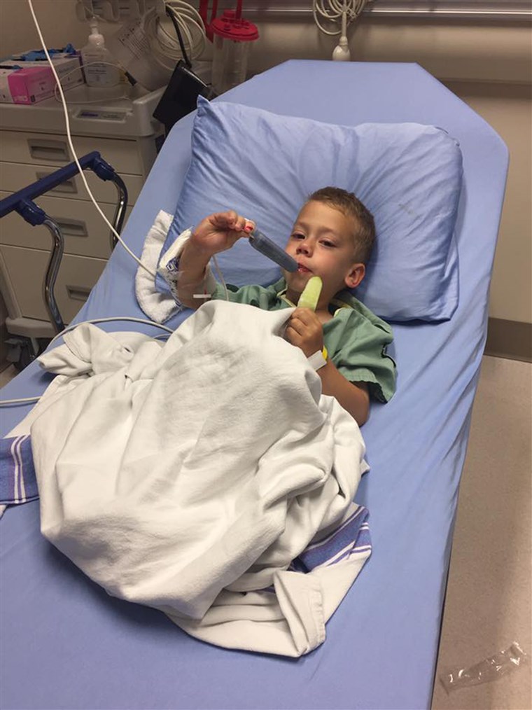 オリバー Schenn enjoys popsicles after surgery to remove a wire barbecue brush bristle that lodged in his throat.