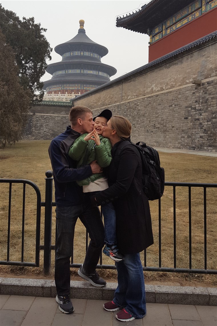マット and Kristi Smith with their son, Caleb, in Beijing, China.