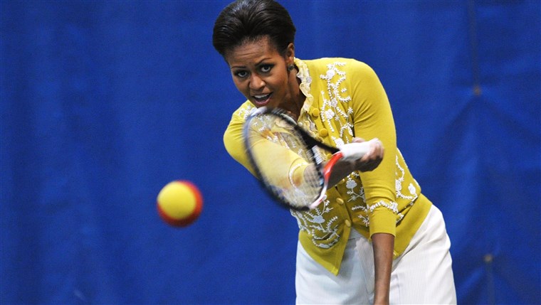 KAMI First Lady Michelle Obama plays tennis while attending a mini-Olympics event with local school children at American University's Bender Arena March...