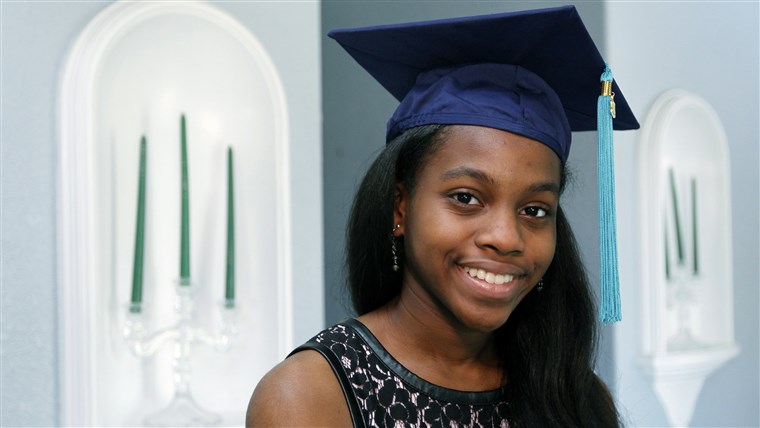 Grazia Bush poses in her university graduation cap.