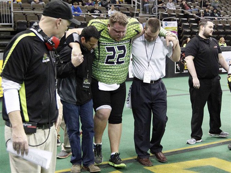 로렌 젠 helped off the field after breaking his ankle in his last professional game in the Continental Indoor Football League.