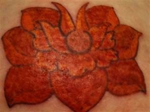 Wendi Duvall lotus flower tattoo