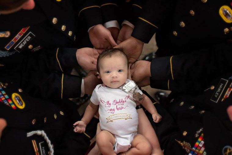 Neonato daughter of fallen soldier does photo shoot with army unit