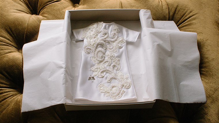 마다 Angel Gown is presented to the family in simple, white boxes and white tissue paper. 