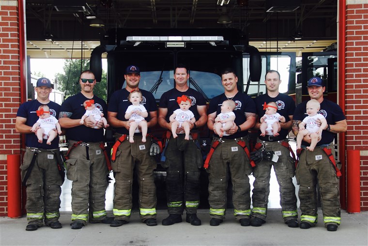 セブン firefighters with their babies pose for picture