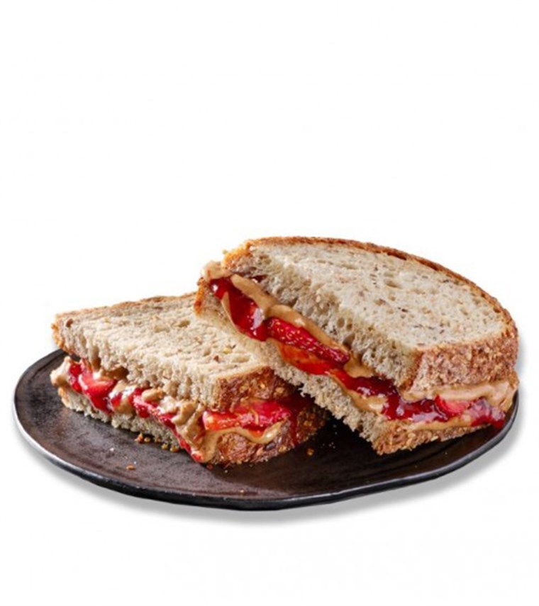 스타 벅스' spin on a classic sandwich. Introducing the chain's Crunchy Almond Butter, Strawberries and Jam Sandwich.