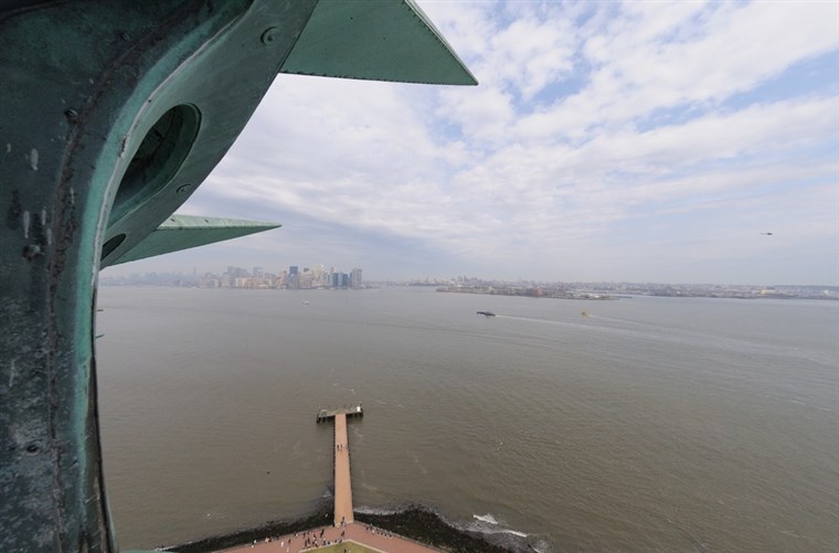 방문객 to the crown of the Statue of Liberty get a great look at New York Harbor.