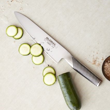 koki's knife cutting cucumbers