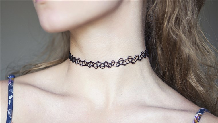 seorang yg mencekik necklace on young woman