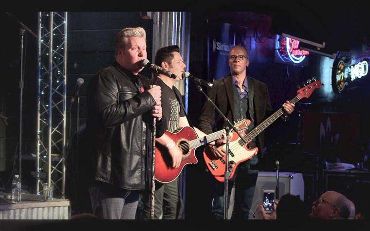 HARI INI's Lester Holt joins The Rascal Flatts on stage at the Diffle and Steel Guitar Grill in Nashville.