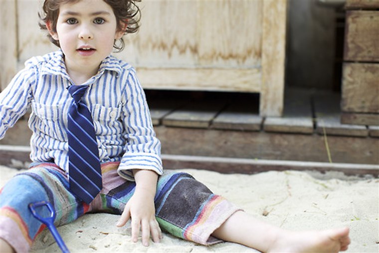 Sedikit gentleman: A boy featured on Ladys & Gents wears a shirt and shorts by Trico Field, tie by Janie & Jack.