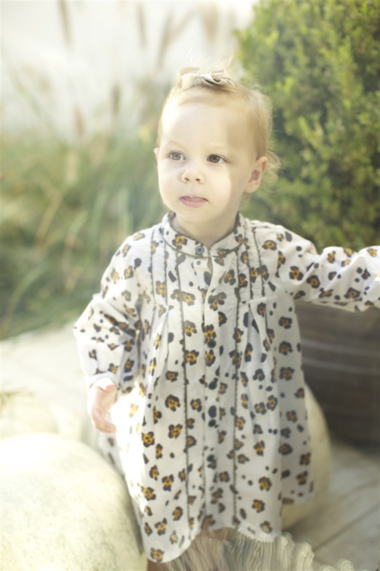 Satu cool baby wears a leopard-print onesie by Trico Field.