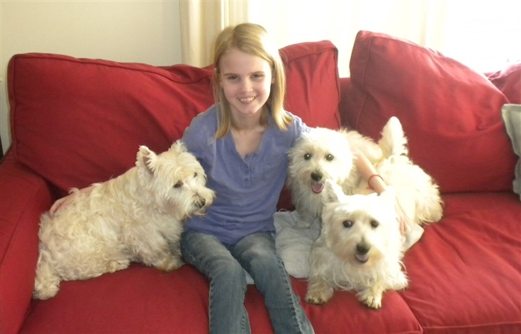 Rahmat Forgea and her three Westies, Chester, Lucy and MacIntosh, 