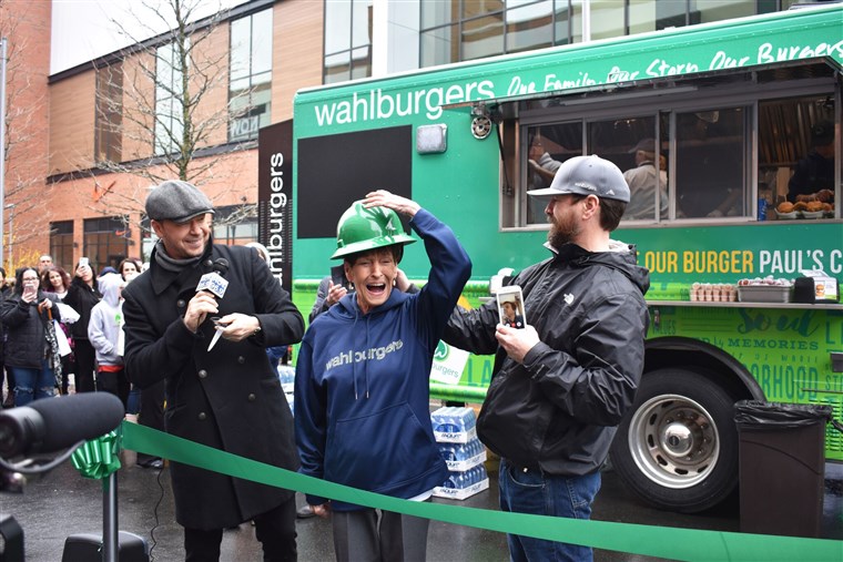 Anggota of the Wahlberg family cut the ribbon at their hometown food truck.