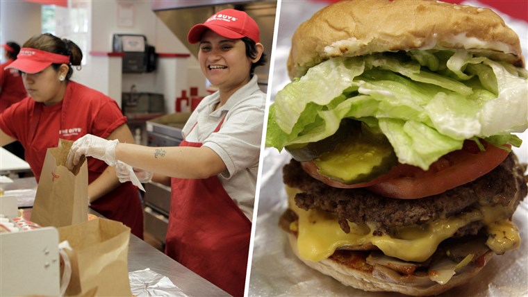 Manajer Kely Guardado prepares hamburgers at a Five Guys restaurant in Washington