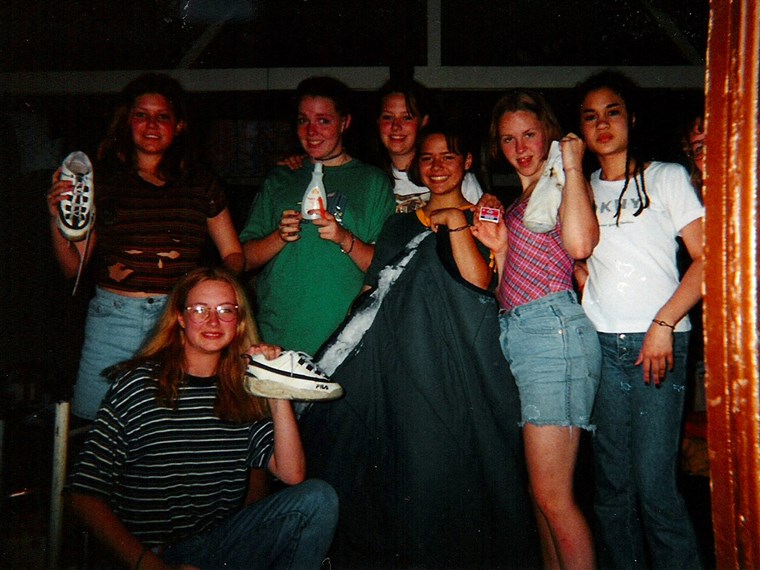 Sarah Culp, in green shirt, along with her camp mates, after a fire caught in their cabin.