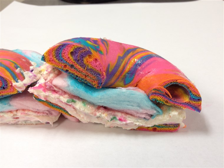 Menyeberang Section of Rainbow Bagel Stuffed with Funfetti Cream Cheese and Cotton Candy from Brooklyn's The Bagel Store